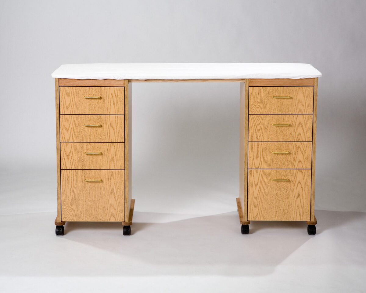 The Cut and Press Station, a 22 by 60 inch cutting and pressing cabinet with drawers