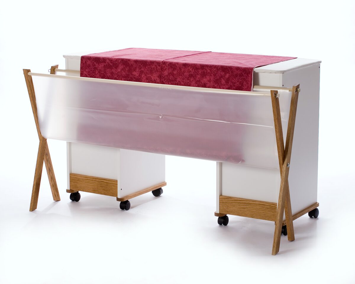 The Ironing Cradle, a 65 inch catchall shelf that hangs beneath an ironing board